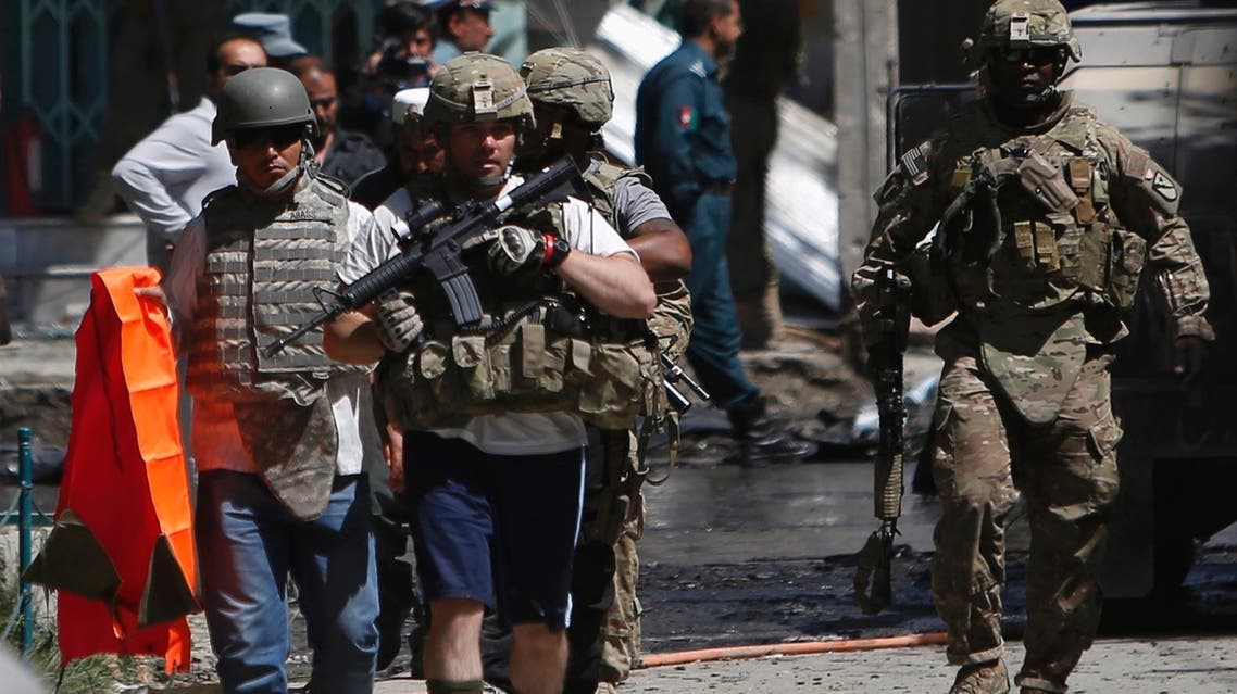 NATO soldiers with the International Security Assistance Force (ISAF) arrive at the site of a suicide attack in Kabul May 16, 2013. (REUTERS)