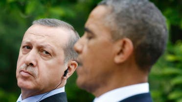 Turkish Prime Minister Recep Tayyip Erdogan (L) listens to U.S. President Barack Obama during a joint news conference in the White House Rose Garden in Washington, May 16, 2013. (Reuters)