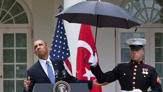 ‘Got an umbrella?’ Obama in media storm after rain incident