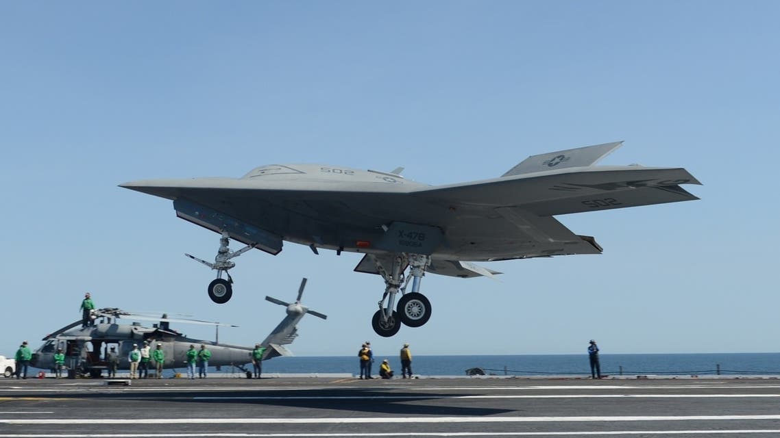 This photo released by the US Navy shows an X-47B unmanned combat air system (UCAS) demonstrator preparing to execute a touch and go landing on May 17, 2013. (AFP)