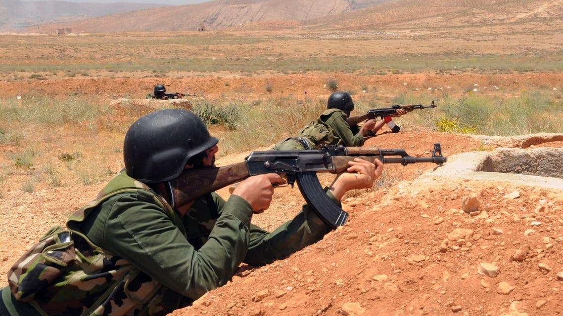 A handout picture released by the Syrian Arab News Agency (SANA) on May 22, 2013 shows Syrian government soldiers taking part in a training exercise at an undisclosed training camp in Syria. AFP