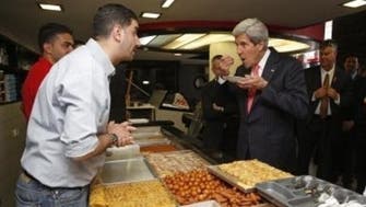 U.S.’s Kerry tucks into Palestinian shawarma and sweets