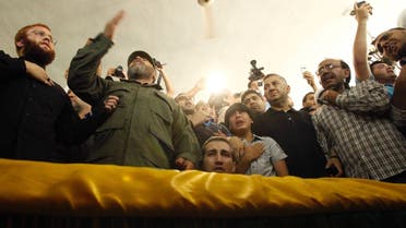 Supporters of Hezbollah and relatives of Hezbollah member Saleh Ahmed Sabagh mourn during his funeral in the port-city of Sidon, southern Lebanon May 22, 2013.