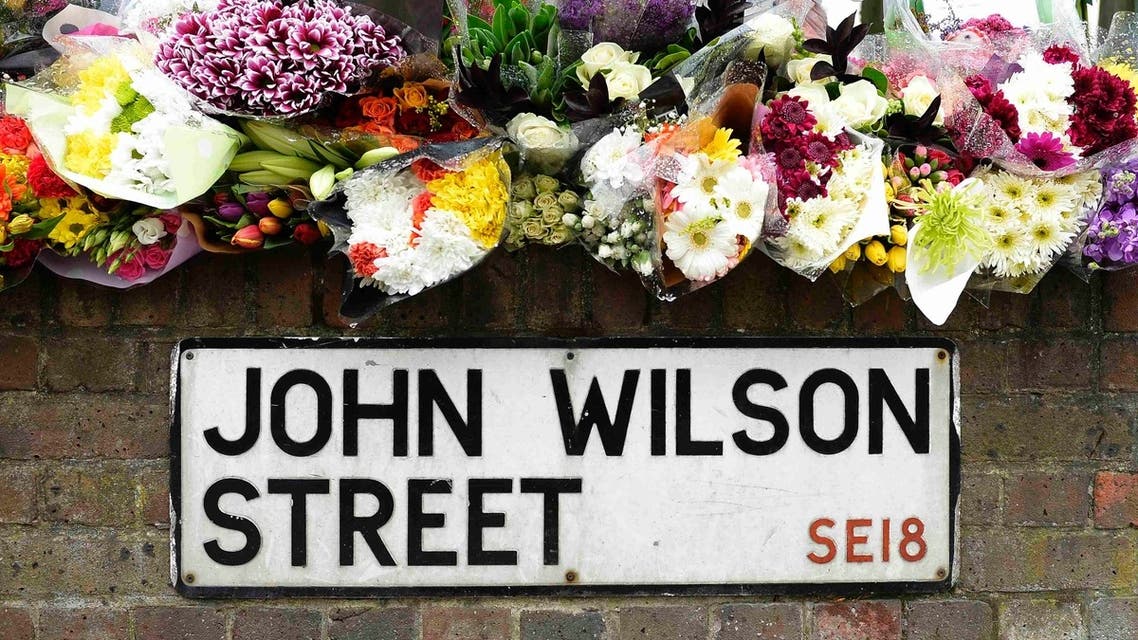 Floral tributes for Drummer Lee Rigby, of the British Army's 2nd Battalion The Royal Regiment of Fusiliers, are lined at the scene of his killing in Woolwich, southeast London May 24, 2013. REUTERS