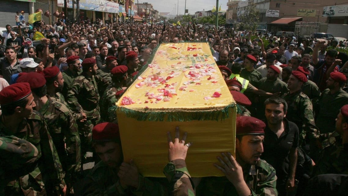 Supporters of Hezbollah and relatives of Hezbollah members attend the funeral of a Hezbollah fighter who died in the Syrian conflict in Ouzai in Beirut May 26, 2013. (Reuters)