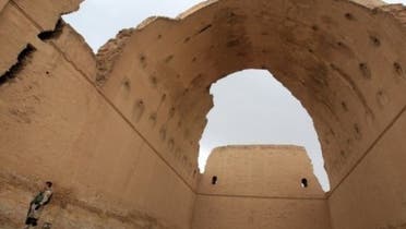 An Iraqi soldier stands under the ancient Arch of Ctesiphon near Baghdad on May 15, 2013 (AFP)