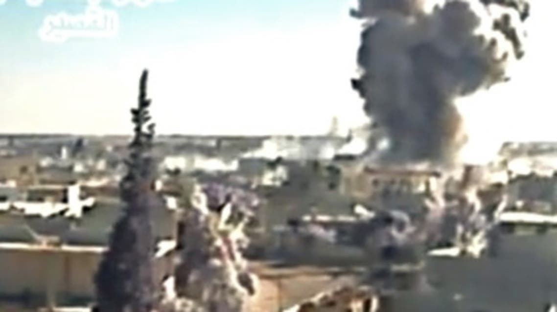 A image grab taken from a video uploaded on Youtube by Al-Qusayr Media Centre on May 26, 2013 allegedly shows smoke billowing from buildings in the city of Qusayr, in Syria's central Homs province, following an airstrike by government forces. (AFP)