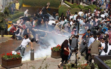 Turkish riot police use tear gas to disperse demonstrators during a protest against the destruction of trees in a park brought about by a pedestrian project, in Taksim Square in central Istanbul May 31, 2013. (Reuters)