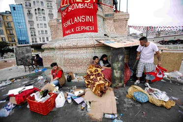 Demonstrators rest in Taksim Square where police and anti-government protesters clashed in central Istanbul June 2, 2013. (Reuters)