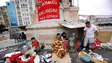Demonstrators rest in Taksim Square where police and anti-government protesters clashed in central Istanbul June 2, 2013. (Reuters)