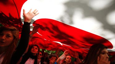Protesters carry the Turkish flag and shout anti-government slogans during a demonstration at Gezi Park near Taksim Square in central Istanbul June 3, 2013. (Reuters)