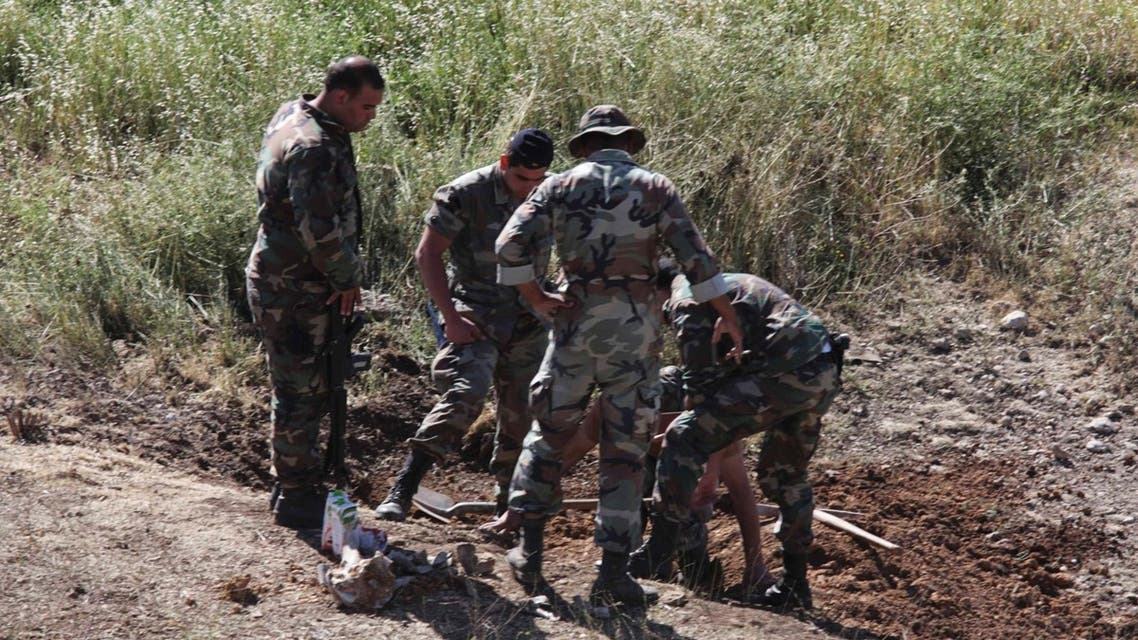 Lebanese Army soldiers inspect the site which was hit by a rocket, which residents say was fired from Syria, in the town of Baalbek in Lebanon's Bekaa valley June 6, 2013. AFP