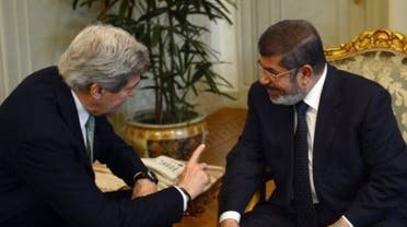 US Secretary of State John Kerry (L) talks with Egyptian President Mohammad Morsi in Cairo on March 3, 2013. (AFP)