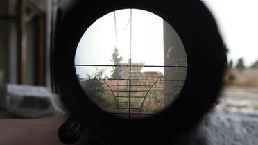 A Syrian regime gathering point is seen through a sniper scope in Aleppo's Karm al-Jabal district June 8, 2013. (Reuters)