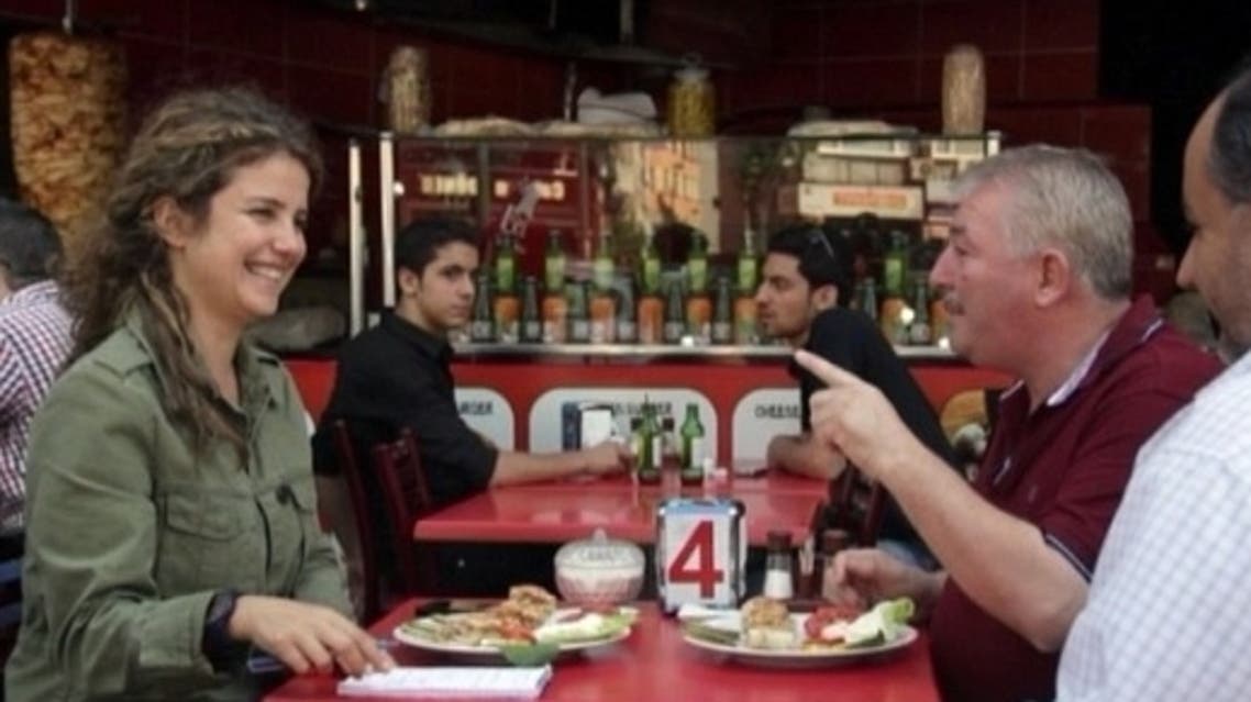 Mohammad Bitar's (R) restaurants unite Syrians that originate from all over the war-torn country.