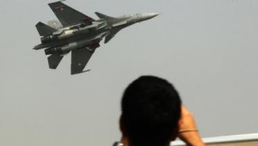 Visitors watch a fighter jet perform during the Aero India Show in Bangalore on February 7, 2013 (AFP/File)