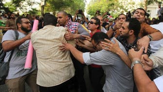 Mursi supporters, opponents clash outside culture ministry       