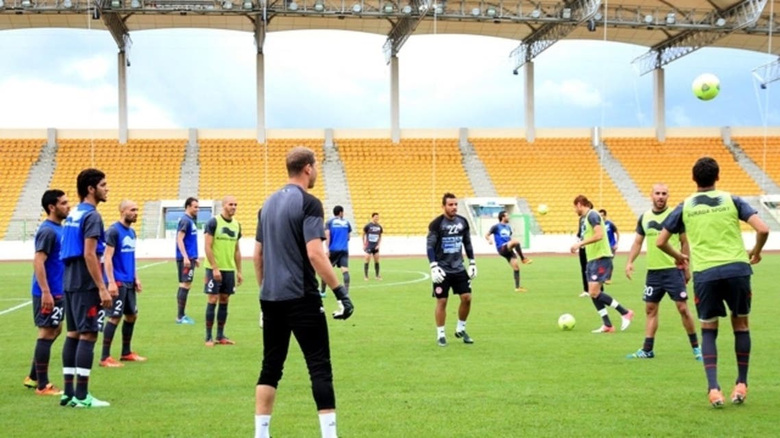 Tunisian football team players warm up during a training session at the Malabo stadium in Guinea on June 15, 2012 ahead of their 2014 World Cup qualifying football match against Equatorial Guinea. (AFP)