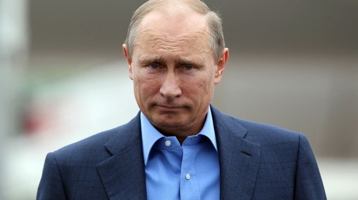 2) Russian President Vladimir Putin arrives at Belfast International airport in Belfast, Northern Ireland, on June 17, 2013, to attend the G8 summit at the Lough Erne resort. (AFP)