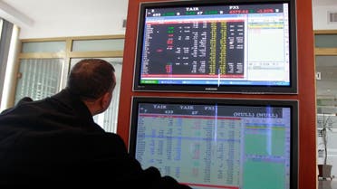 An investor monitors a screen at the Tunisia Stock Exchange. Islamic finance is forecast to take a 25 to 40 percent share of the sector by 2018. (File photo: Reuters)