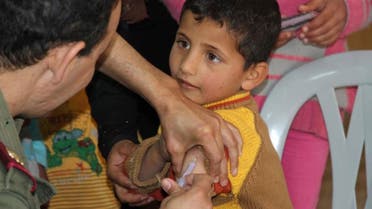 A Syrian boy gets his measles jab in Zaatari refugee camp in Jordan. Photo: UNICEF