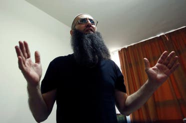 Sunni Muslim Salafist leader Ahmad al-Assir gestures as he speaks in his office in Abra, near Sidon REUTERS