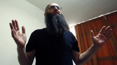 Sunni Muslim Salafist leader Ahmad al-Assir gestures as he speaks in his office in Abra, near Sidon REUTERS
