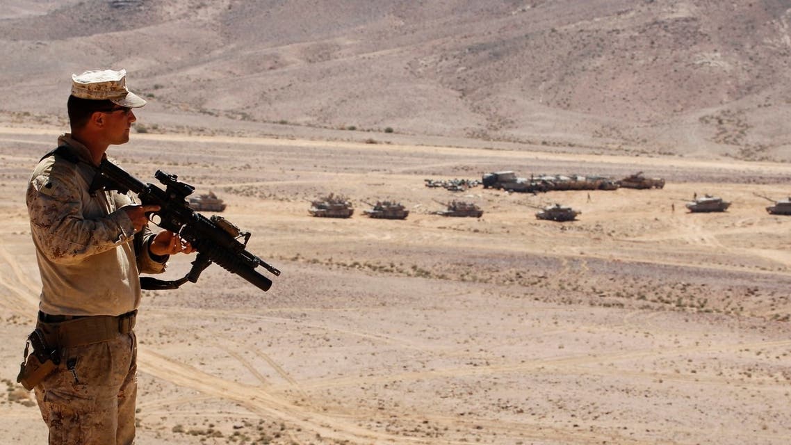 A U.S. soldier stands on top of a hill during the Eager Lion military exercise near the southern town of al-Quweira, 50 km (30 miles) from the coastal city of Aqaba June 19, 2013. (Reuters)