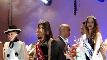 Rym Amari, Miss Algeria 2013, (C) stands with French beauty contest organiser Genevieve de Fontenay (L) and one of the runners-up at the end of the beauty pageant in the western city of Oran late on June 21, 2013. (AFP)