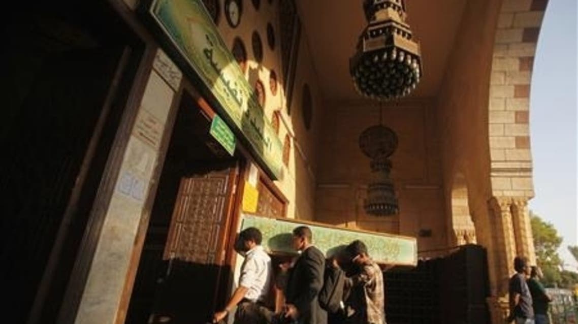 Egyptians carry the coffin of a Shi'ite victim, who was killed in sectarian violence, before funeral prayers in El Sayeda Nafisa Mosque in Cairo, June 24, 2013. (Reuters)