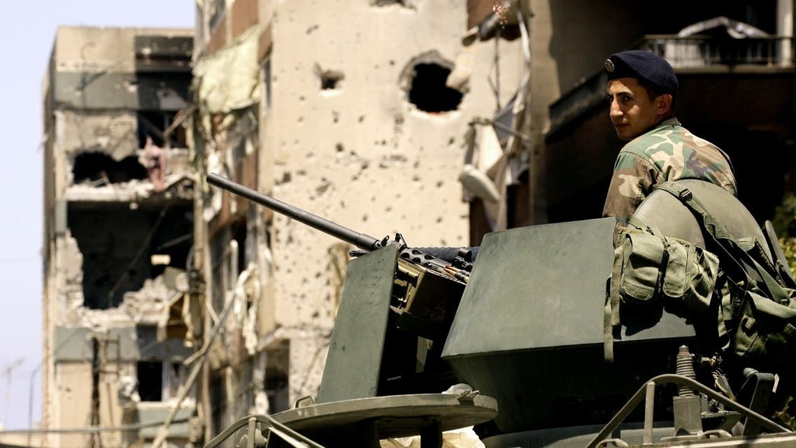 A Lebanese soldier monitors the area outside the Bilal bin Rabah mosque, scene of this week's deadly clashes between the Lebanese army and supporters of radical Sunni cleric Sheikh Ahmad al-Assir, in the Abra district of the southern city of Sidon on June 28, 2013. AFP
