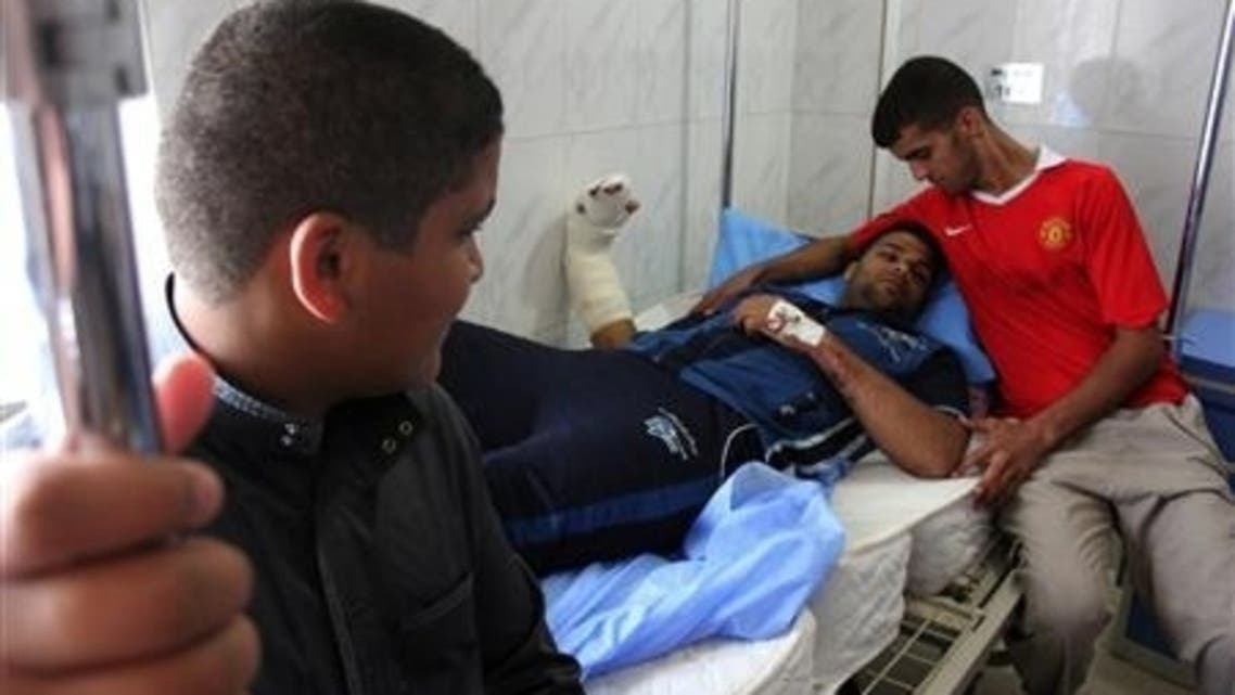 A man lies on a hospital bed after being wounded during one of two bomb attacks in the city of Baquba, about 50 km (31 miles) northeast of Baghdad, June 28, 2013.