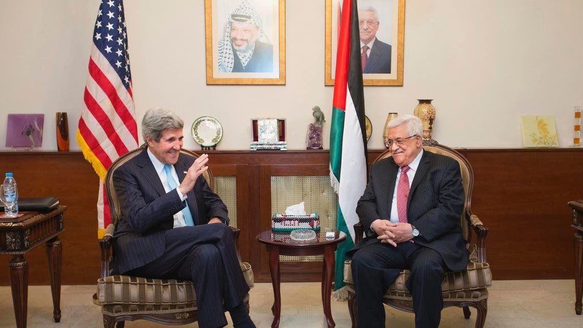 U.S. Secretary of State John Kerry (L) speaks with Palestinian President Mahmoud Abbas in Amman June 28, 2013. REUTERS