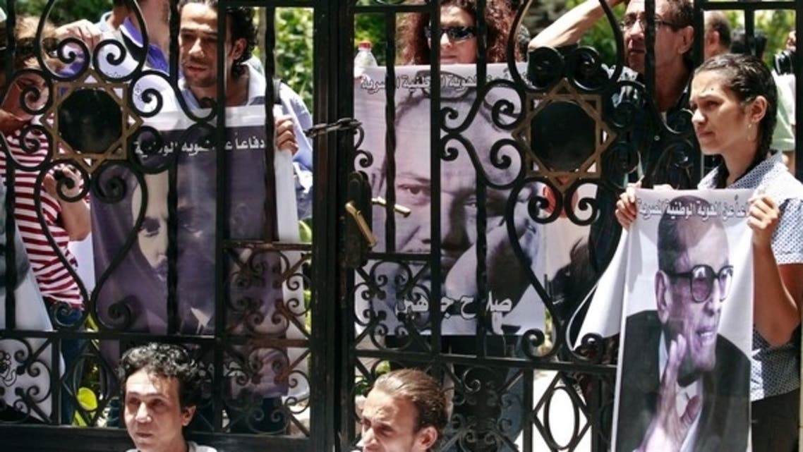 Intellectuals and artists protesting against President Mohammed Mursi carry pictures of popular Egyptian artists and writers in front of the Ministry of Culture in Cairo to demonstrate against what they claim is the increasing influence of the Muslim Brotherhood over the ministry, June 9, 2013.