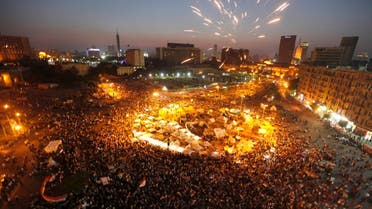 Protesters opposing Egyptian President Mohamed Mursi shout solgans and set off fireworks during a protest in Tahrir square in Cairo June 29, 2013.
