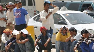 Foreign illegal labourers wait in a long queue outside the Saudi immigration offices at Al Isha quarter of Al Khazan district, west of Riyadh, on Tuesday (AFP photo)