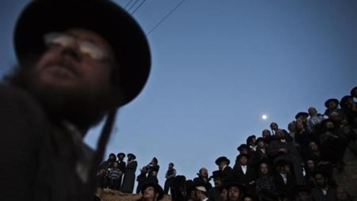 Ultra-Orthodox Jews take part in the “Mayim Shelanu” ceremony to collect water from a natural spring, near Jerusalem March 24, 2013. (Reuters)
