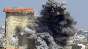 A handout picture released by the opposition-run Shaam News Network on June 2, 2013, shows smokes rising as a mortar shell hits a building in the town of al-Hula in the Syrian province of Homs. (File photo: AFP)