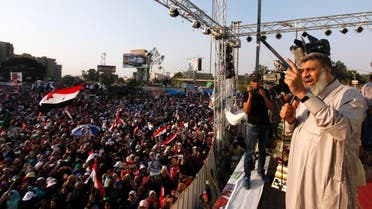 Brotherhood leader Asem Abd-ElMaged delivers a speech to supporters of deposed Egyptian President Mohamed Mursi shout slogans during a protest in Cairo July 7, 2013. (Reuters)