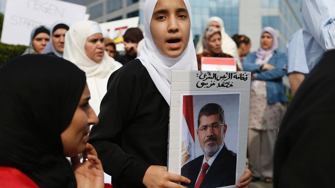 A supporter of ousted Egyptian President Mohamed Mursi chants slogans during a protest in front of the European Union Council building in Brussels July 12, 2013. (Reuters)