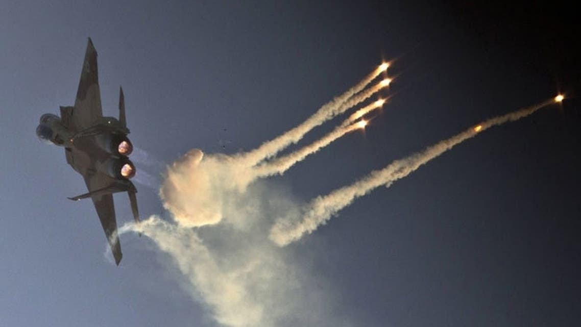 An Israeli F-15 I fighter jet launches anti-missile flares. (AFP Photo)