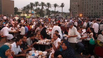 Muslims and Christians gather at Tahrir Square for Ramadan meal