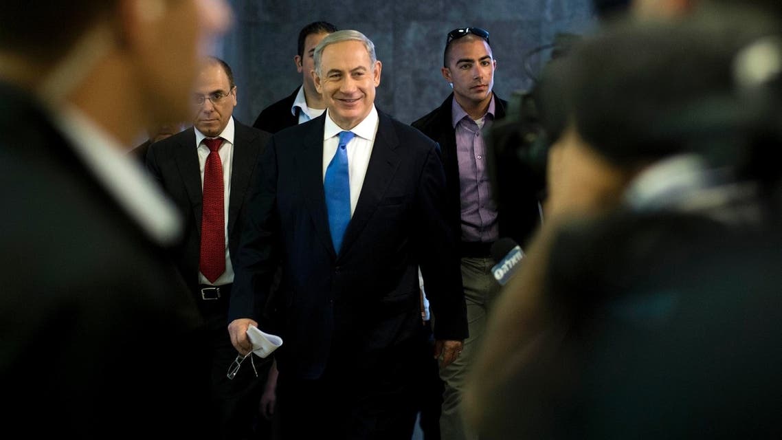 Israel's Prime Minister Benjamin Netanyahu (C) arrives to the weekly cabinet meeting in Jerusalem July 14, 2013. (Reuters)