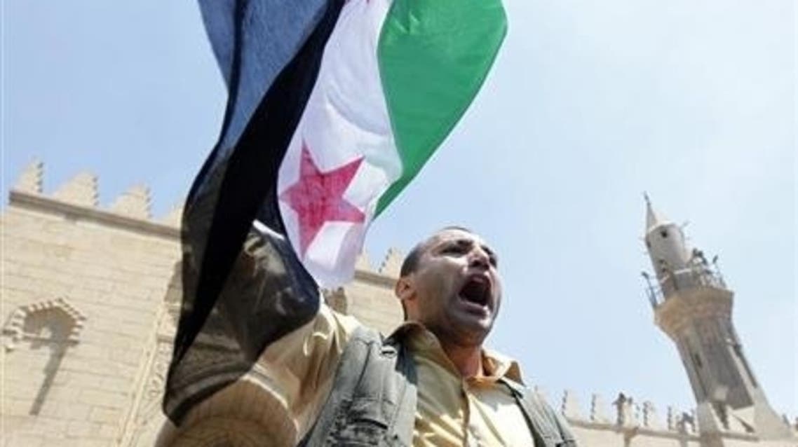 Egyptian protester shout slogans holds a Syrian flag during a protest in support of Syrian rebels outside a mosque in Cairo. (File photo: Reuters)