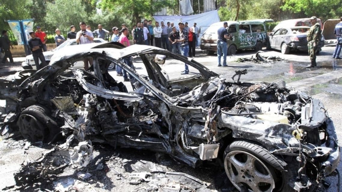 People gather at the scene of an explosion in Damascus on April 29, 2013. (File photo: AFP)