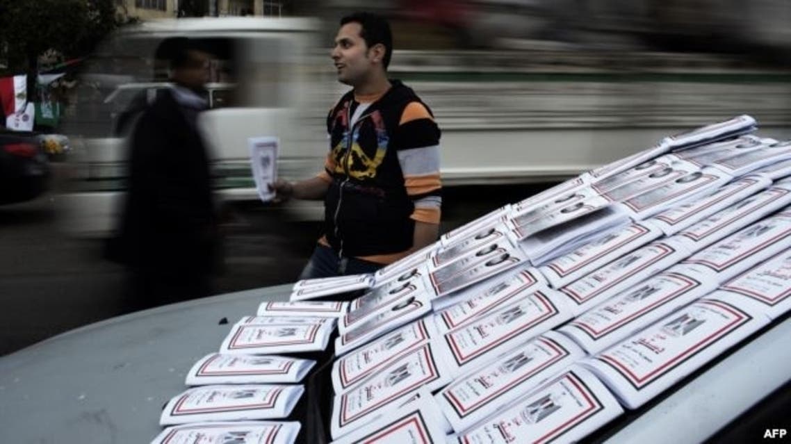 An Egyptian vendor puts on display drafts of the Egyptian constitution. (File photo: AFP)