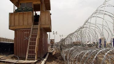 Security observation towers and barbed wire fencing at Abu Ghraib prison, west of Baghdad. (File photo: Reuters)