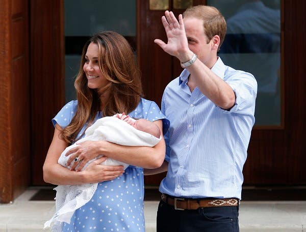 Britain's Prince William and his wife Catherine, Duchess of Cambridge appear with their baby son, as they stand outside the Lindo Wing of St Mary's Hospital, in central London July 23, 2013. (Reuters)