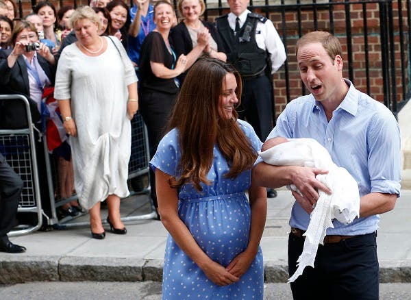 Britain's Prince William and his wife Catherine, Duchess of Cambridge appear with their baby son, as they stand outside the Lindo Wing of St Mary's Hospital, in central London July 23, 2013. (Reuters)