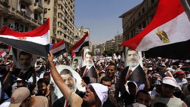 Members of the Muslim Brotherhood and supporters of ousted Egyptian President Mohamed Mursi shout slogans and close the roads during a protest in downtown Cairo July 22, 2013.